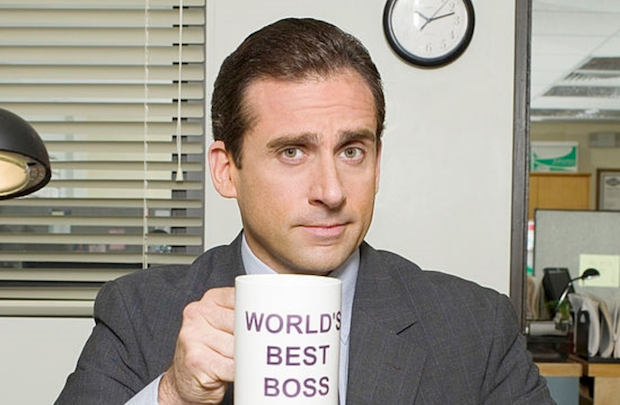 Michael from "The Office" holding a World's Best Boss mug